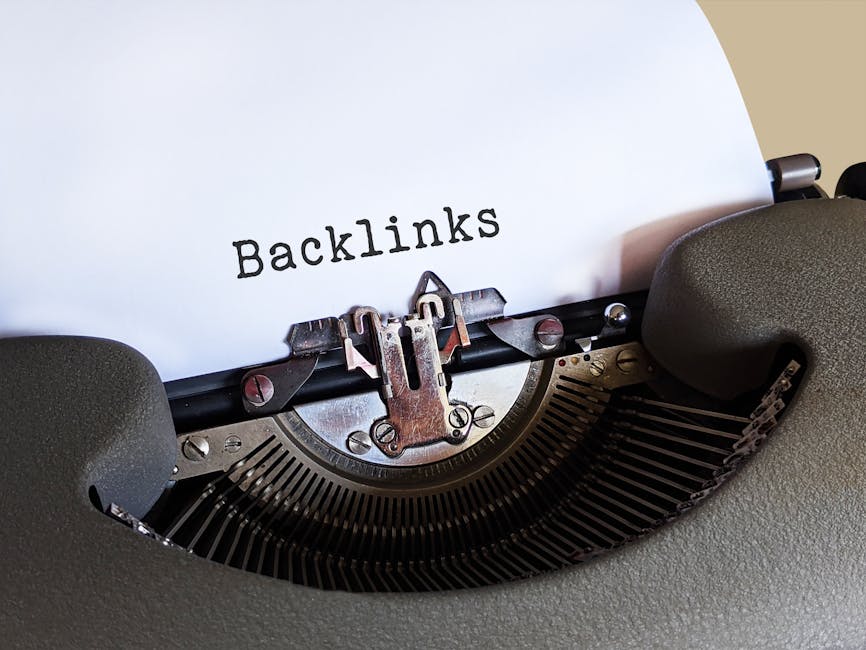 Close-up of a vintage typewriter printing the word 'Backlinks,' emphasizing content and SEO concepts.